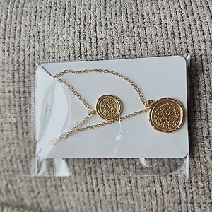 Gold tone coin pendant layered necklace